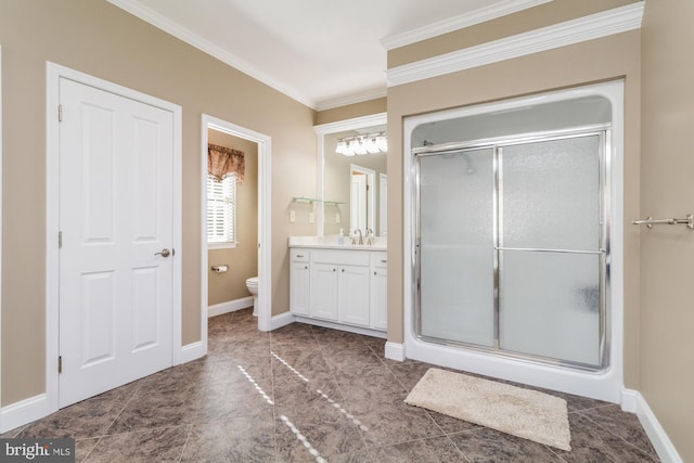 bathroom featuring vanity, crown molding, a shower with door, and toilet