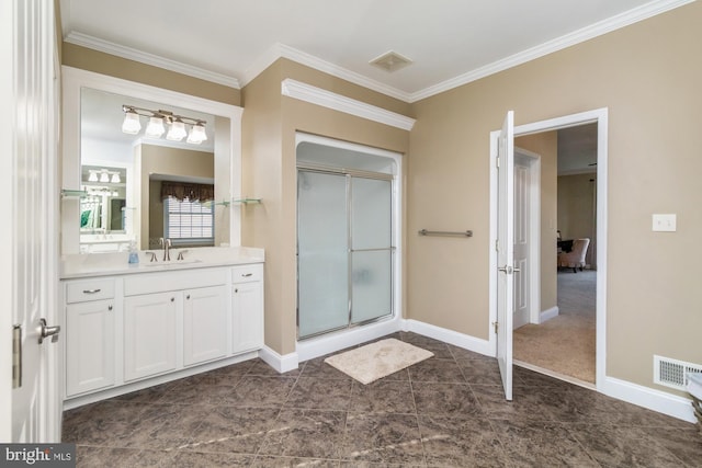 bathroom featuring vanity, ornamental molding, and walk in shower