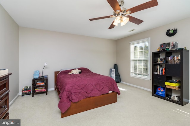 carpeted bedroom featuring ceiling fan