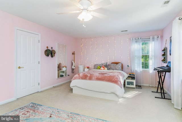 carpeted bedroom with ceiling fan