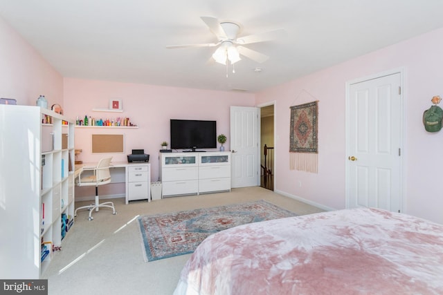 bedroom with light colored carpet and ceiling fan