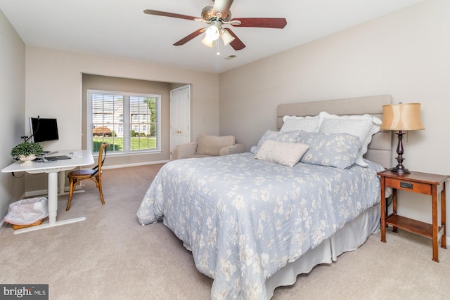 bedroom with ceiling fan and carpet flooring