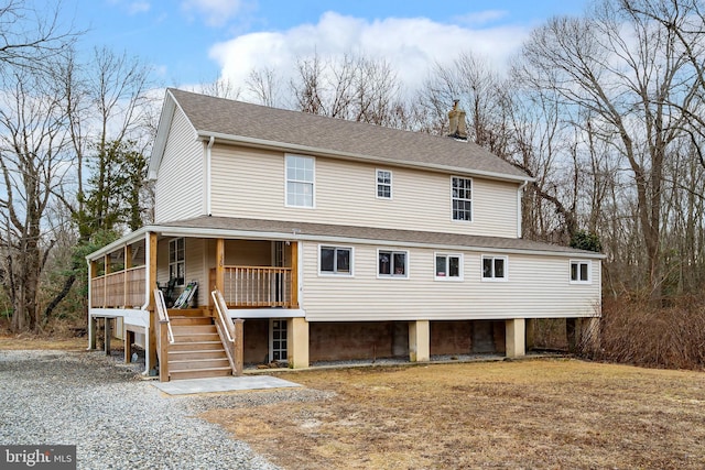 country-style home featuring covered porch