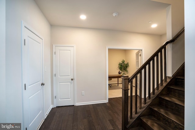 entrance foyer featuring dark hardwood / wood-style floors