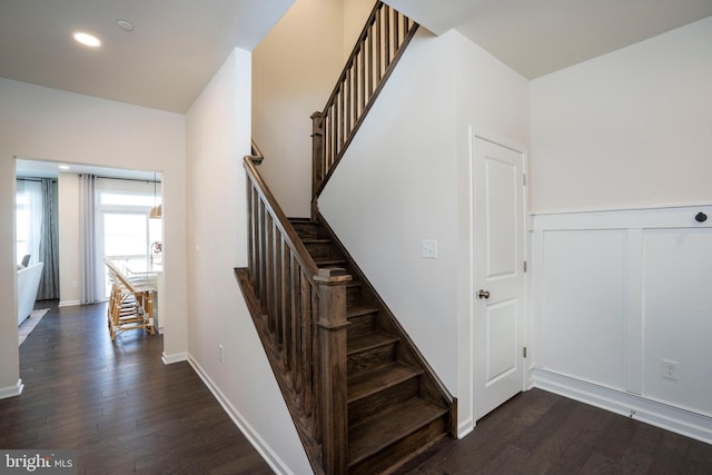 staircase featuring wood-type flooring