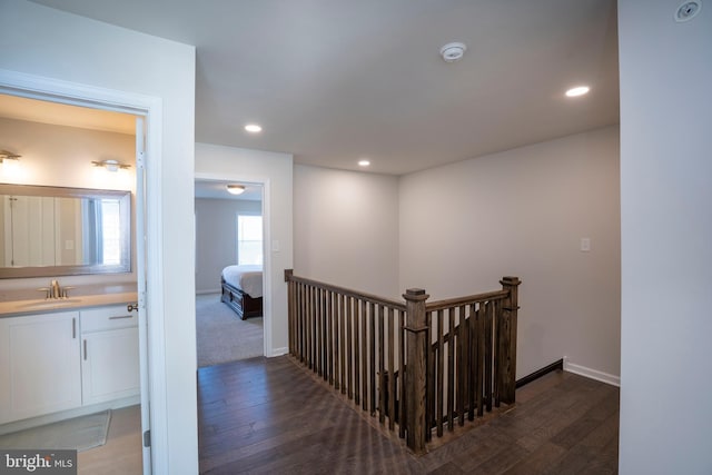 hall with sink and dark hardwood / wood-style floors