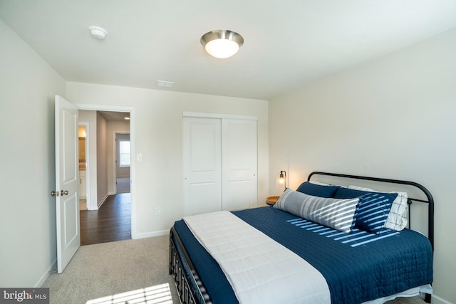 carpeted bedroom featuring a closet