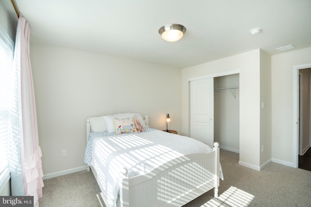 carpeted bedroom featuring a closet