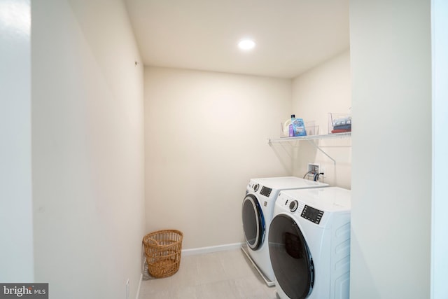 washroom featuring washing machine and dryer