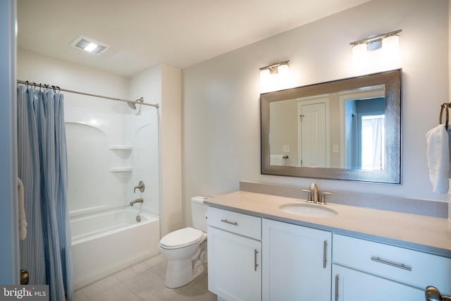 full bathroom with tile patterned flooring, vanity, toilet, and shower / bath combo with shower curtain