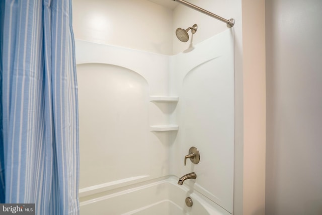 bathroom featuring shower / bath combination with curtain