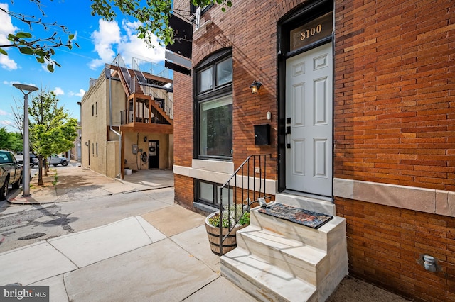 3100 E Lombard St, Baltimore, MD 21224 - doorway to property featuring brick siding