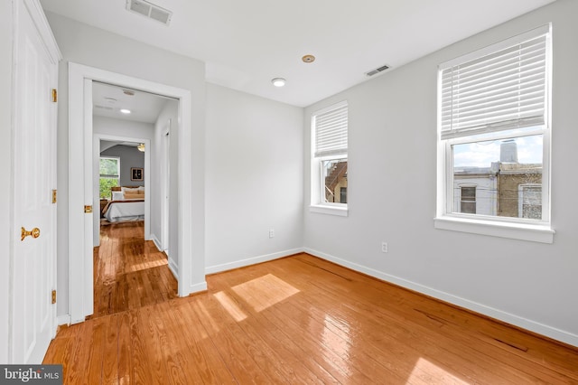 3100 E Lombard St, Baltimore, MD 21224 - unfurnished bedroom with light wood-style floors, baseboards, and recessed lighting