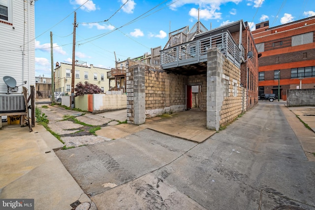 3100 E Lombard St, Baltimore, MD 21224 - view of property exterior featuring concrete block siding and a balcony