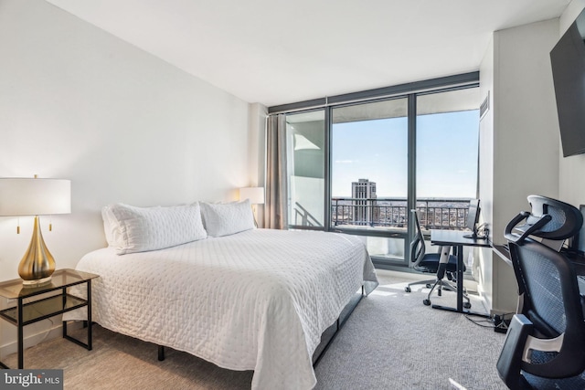 bedroom featuring carpet and floor to ceiling windows