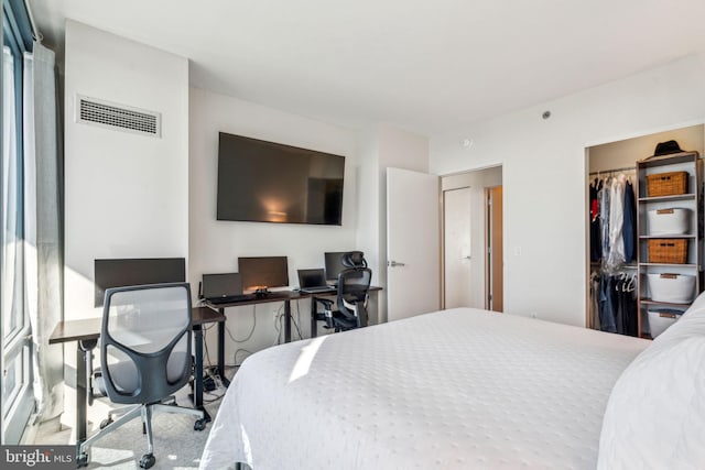 bedroom with visible vents and a closet