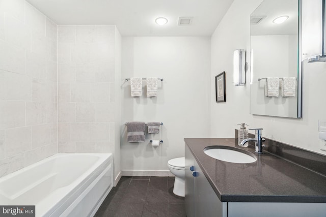 full bath with toilet, vanity, visible vents, tile patterned floors, and a bathtub