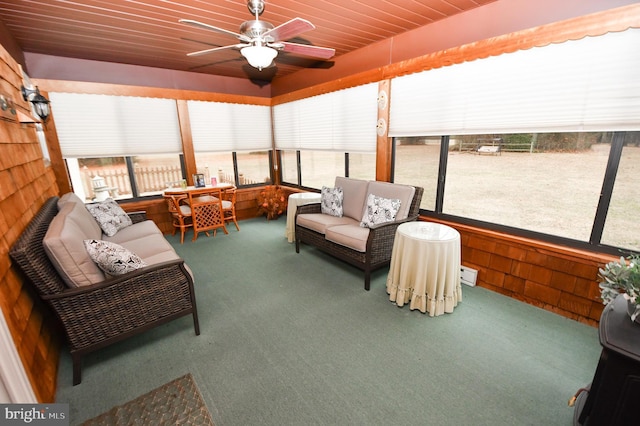 sunroom with wood ceiling and ceiling fan