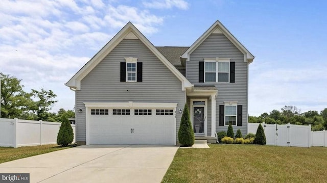 view of front of property with a garage and a front yard