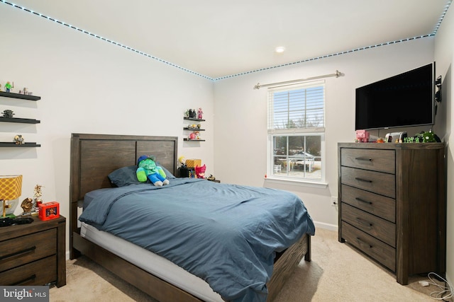 bedroom with light colored carpet