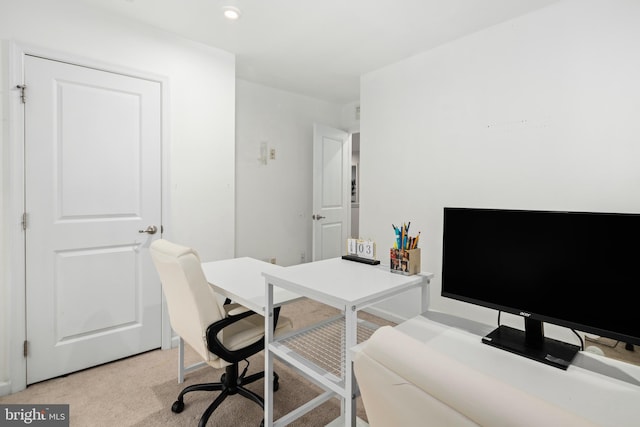 office area featuring light colored carpet