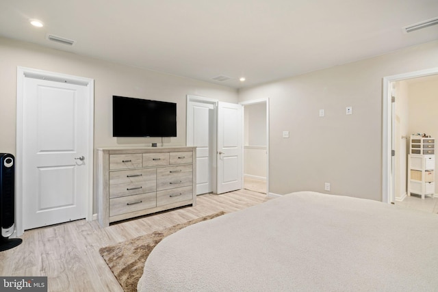 bedroom with light wood-type flooring