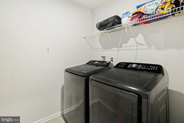 laundry room with independent washer and dryer