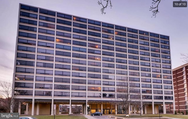 view of outdoor building at dusk