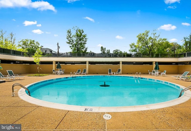 view of pool featuring a patio