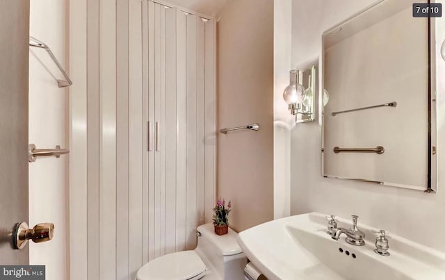 bathroom with sink and toilet