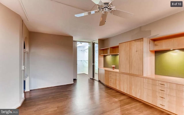 unfurnished room with ceiling fan and dark hardwood / wood-style floors