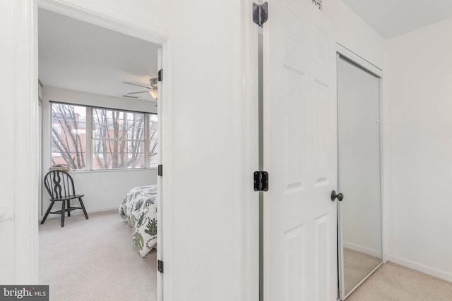 bedroom featuring light carpet