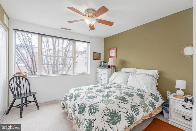 carpeted bedroom featuring ceiling fan