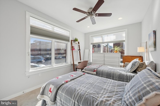 carpeted bedroom with a ceiling fan, recessed lighting, and baseboards