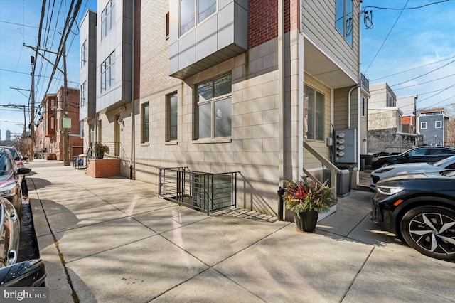 view of side of property with brick siding