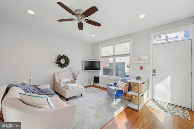 living room with light wood-style floors, recessed lighting, and a ceiling fan