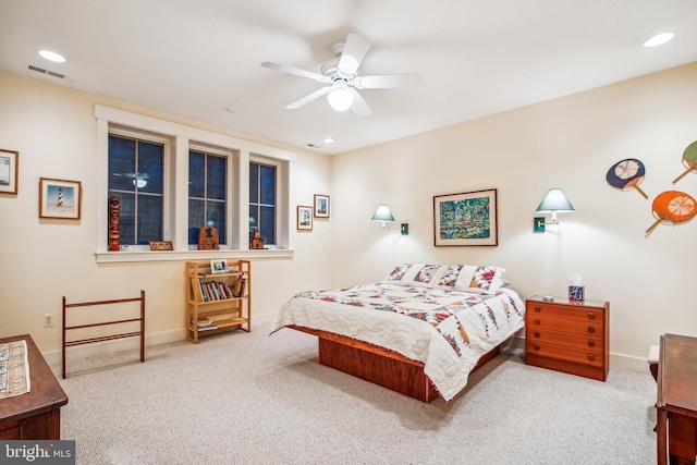 bedroom featuring light carpet and ceiling fan