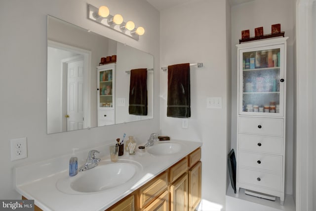 bathroom featuring double vanity and a sink