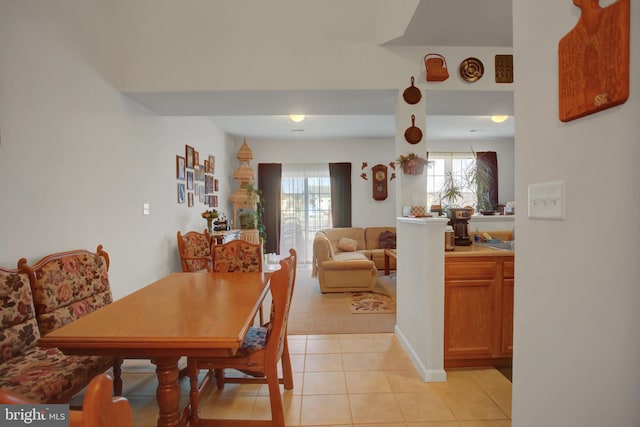 dining area with light tile patterned floors