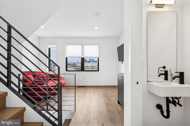 interior space with wood-type flooring and sink