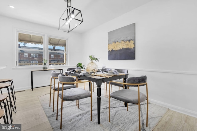 dining room with light wood-type flooring