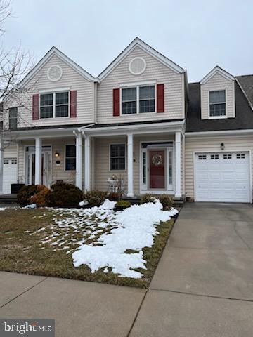 103 Candor Ln, Dover, DE 19901 - view of front of property with covered porch, driveway, and an attached garage
