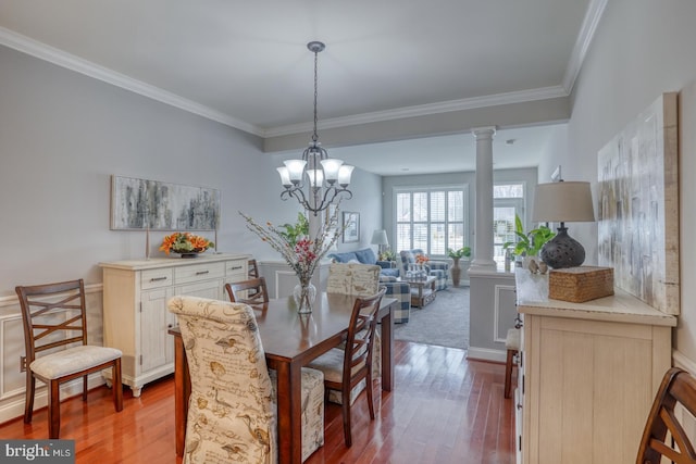 103 Candor Ln, Dover, DE 19901 - dining area with a wainscoted wall, ornamental molding, wood finished floors, and ornate columns