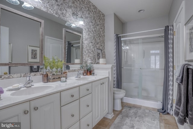 103 Candor Ln, Dover, DE 19901 - bathroom featuring double vanity, a stall shower, a sink, and toilet