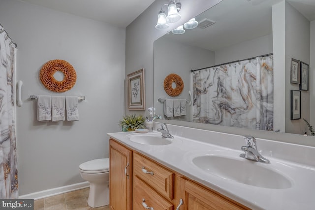 103 Candor Ln, Dover, DE 19901 - full bath with double vanity, tile patterned flooring, a sink, and toilet