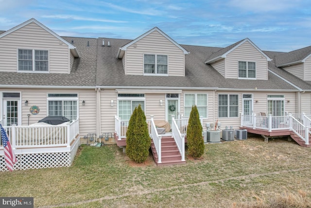 103 Candor Ln, Dover, DE 19901 - view of front of house with a shingled roof, a front yard, a wooden deck, and central air condition unit