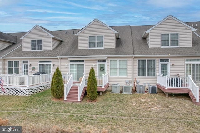 103 Candor Ln, Dover, DE 19901 - view of front of home featuring a deck, roof with shingles, a front yard, and central air condition unit