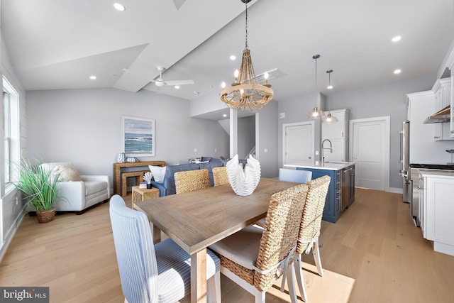 dining room featuring light wood-style floors, lofted ceiling, ceiling fan, and recessed lighting