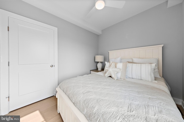 bedroom with a ceiling fan and wood finished floors