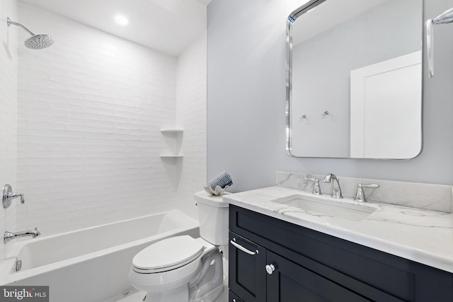 full bath with washtub / shower combination, vanity, and toilet